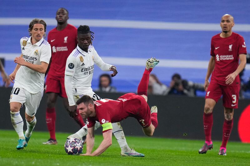 Liverpool's James Milner falls in front of Eduardo Camavinga. AP