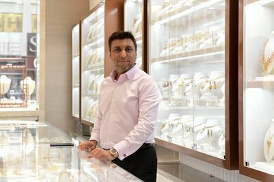 Vishal Dhakan, director of Dhakan Jewellers, at one of his outlets in the Deira Gold Souq in Dubai. Business has been good this year, he says. Khushnum Bhandari / The National