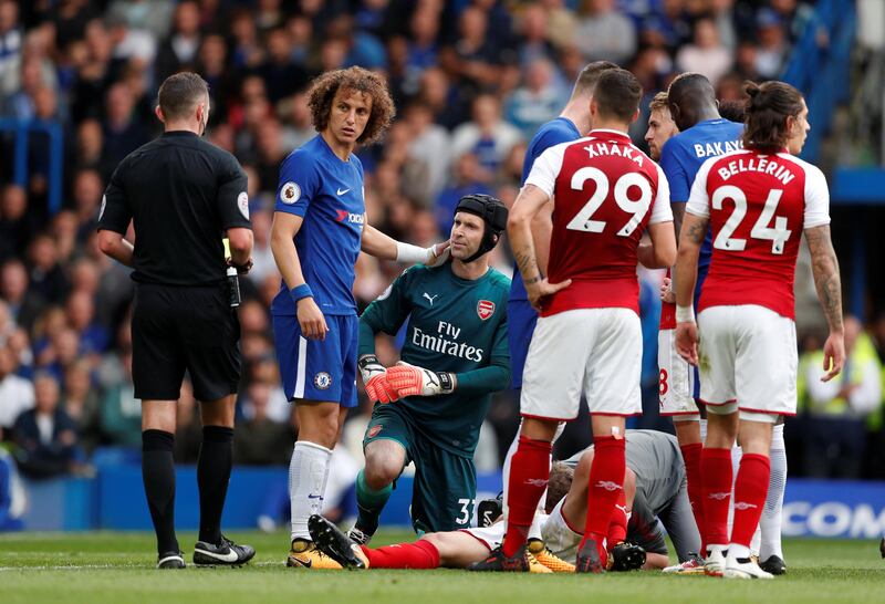 Chelsea's David Luiz is shown a yellow card by referee Michael Oliver. Luiz would later be sent off. John Sibley / Reuters