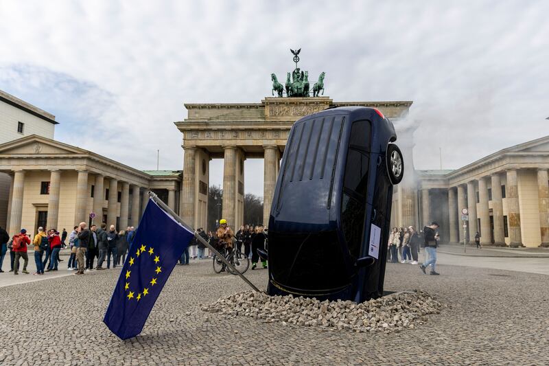 An installation mounted by Greenpeace protesters at Berlin's Brandenburg Gate, against Germany's stance on zero-emission cars. Getty