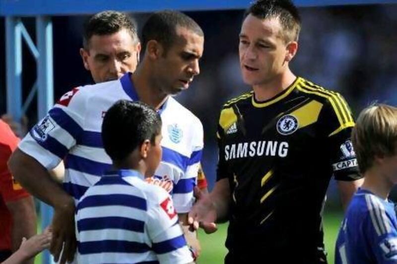 Anton Ferdinand, right, walked past John Terry without shaking his hand. Glyn Kirk / AFP