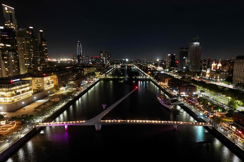 The Puente de la Mujer bridge is pictured with its lights turned off during the Earth Hour environmental campaign at Puerto Madero neighborhood in Buenos Aires. AFP