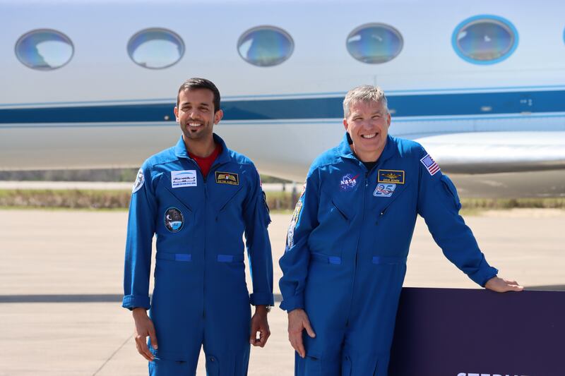 Dr Al Neyadi with the mission's commander, Stephen Bowen, on February 23, days before their flight to the ISS. Sarwat Nasir / The National 