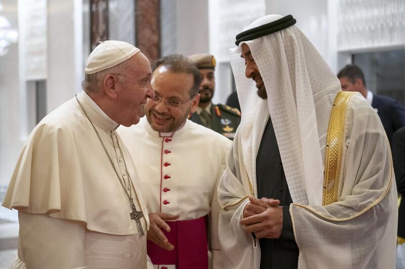 ABU DHABI, UNITED ARAB EMIRATES - February 3, 2019: Day one of the UAE papal visit - HH Sheikh Mohamed bin Zayed Al Nahyan, Crown Prince of Abu Dhabi and Deputy Supreme Commander of the UAE Armed Forces (R), receives His Holiness Pope Francis, Head of the Catholic Church (L), at the Presidential Airport. 

( Ryan Carter / Ministry of Presidential Affairs )
---