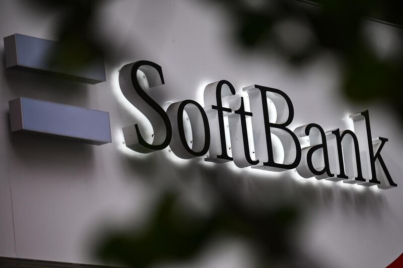 The SoftBank logo is seen at the entrance of a mobile shop in Tokyo on November 9, 2020, as SoftBank Group said first-half net profit soared 346.7 percent, sealing a strong recovery after a massive annual loss, as tech stocks rally and the firm sheds assets to shore up its finances. / AFP / CHARLY TRIBALLEAU
