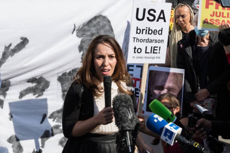 Stella Moris, Julian Assange's partner, addresses supporters outside the the High Court in London. Getty