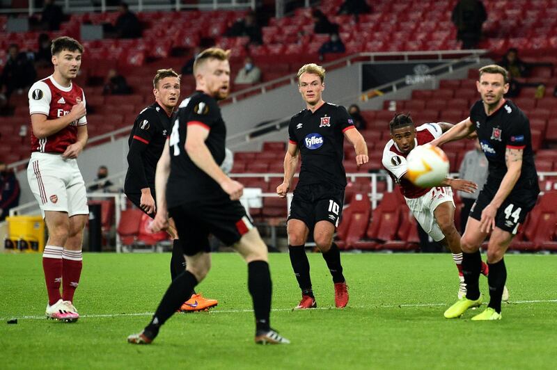 Arsenal's midfielder Reiss Nelson takes a shot during the match against Dundalk. AFP