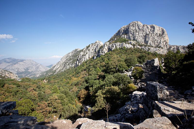 The ancient city of Termessos was built at an altitude of more than 1,000 metres on Mount Solymos, in the modern-day Turkish province of Antalya. Here is a view of the upper city wall on the right and the Pamphylian plain beyond. Charlotte Mayhew / The National