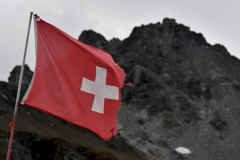 A Swiss national flag flutters during a ceremony to mark the 'death' of the Pizol glacier (Pizolgletscher) above Mels, eastern Switzerland. AFP