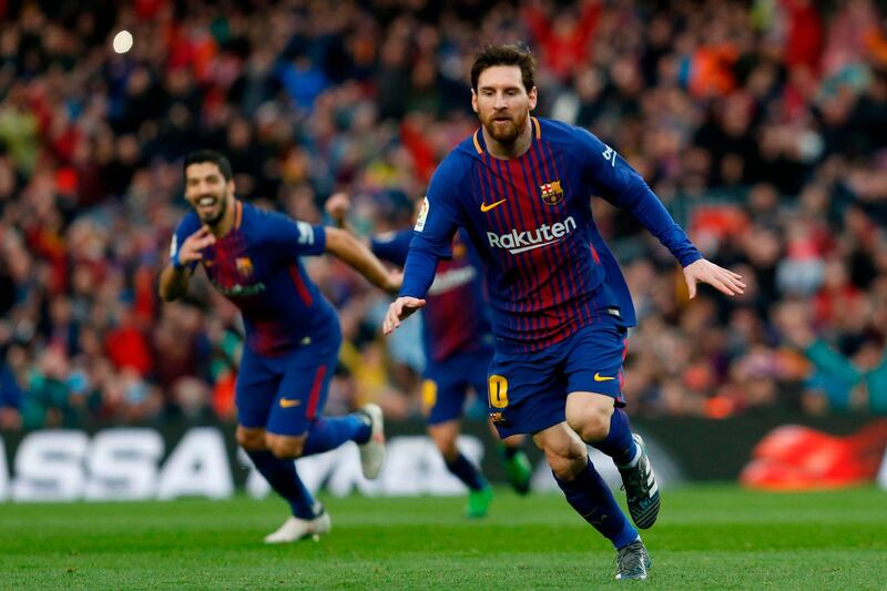 Barcelona's Argentinian forward Lionel Messi celebrates after scoring during the Spanish league football match FC Barcelona against Club Atletico de Madrid at the Camp Nou stadium in Barcelona on March 04, 2018. / AFP PHOTO / Pau Barrena