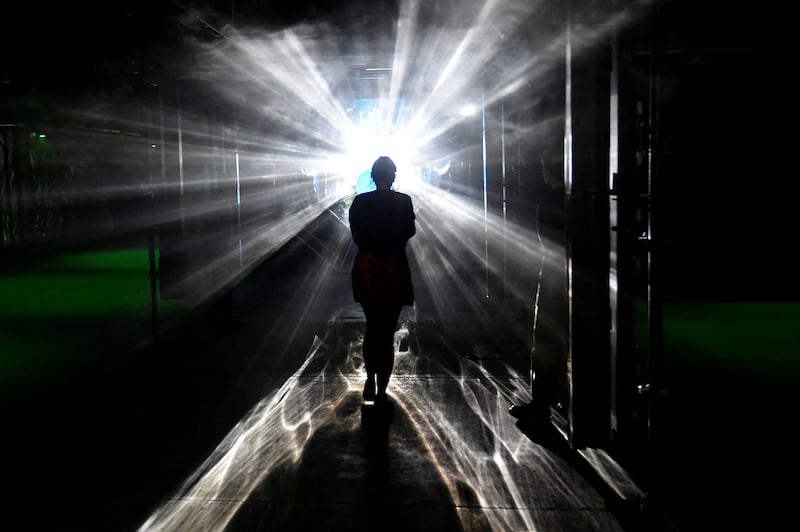 A visitor views 'Vortex' by Hamill Industries which forms part of 'Future Shock', an exhibition of new audio-visual installations by various artists, at 180 Studios, London, Britain, April 27, 2022.  REUTERS/Toby Melville NO RESALES.  NO ARCHIVES      TPX IMAGES OF THE DAY