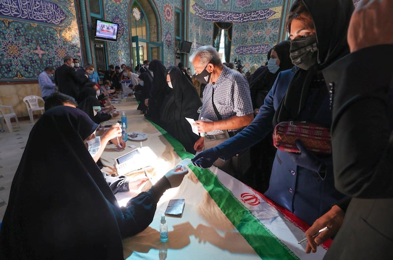 Iranians register to vote at a polling station in the Hosseinyeh Ershad mosque in the capital Tehran during the country's presidential election. AFP