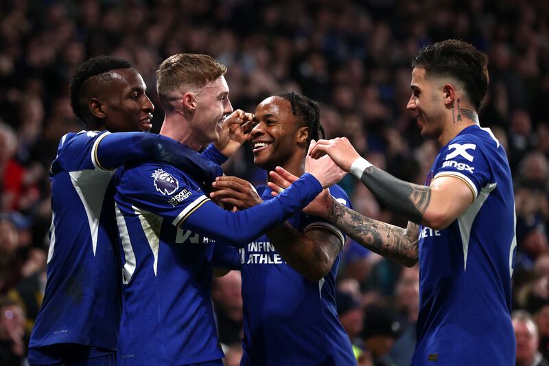 Chelsea players celebrate with Cole Palmer after his goal gave them a 2-1 lead. Getty Images