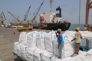 Yemenis receive sacks of food aid packages from the World Food Programme in the port city of Hodeidah in June. AFP