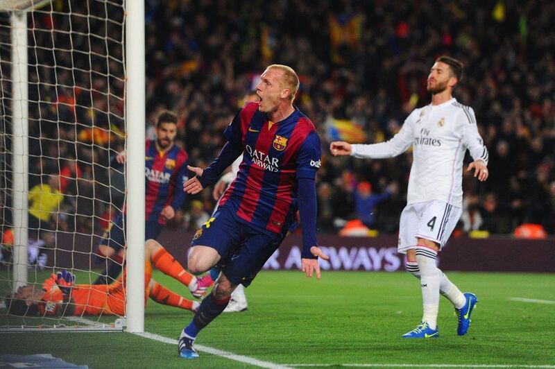 Jeremy Mathieu of Barcelona begins to celebrate after scoring the opening goal in his side's 2-1 La Liga win over Real Madrid on Sunday night at the Camp Nou. Alex Caparros / Getty Images / March 22, 2015 