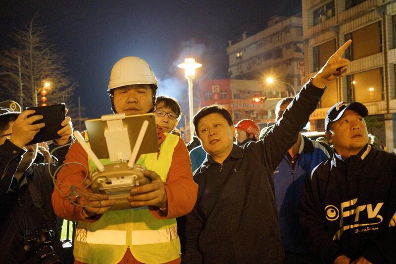 Rescue workers check the quake site in Hualien. Paul Yang / AFP