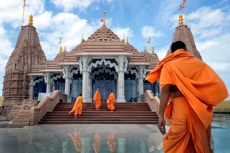Hindu monks arrive at the first stone-built Hindu temple in Abu Mureikha last month. AP