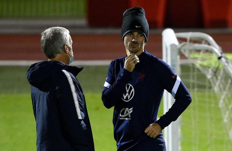 France manager Didier Deschamps talking to forward Antoine Griezmann. AFP