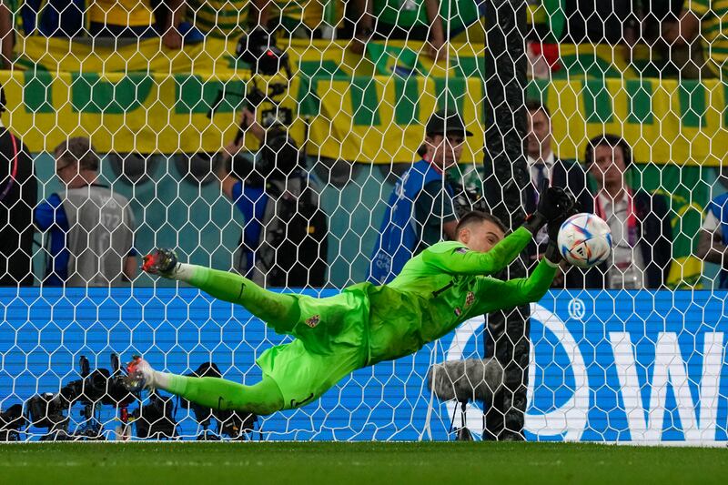Croatia goalkeeper Dominik Livakovic saves from Brazil's Rodrygo during the penalty shoot-out. AP