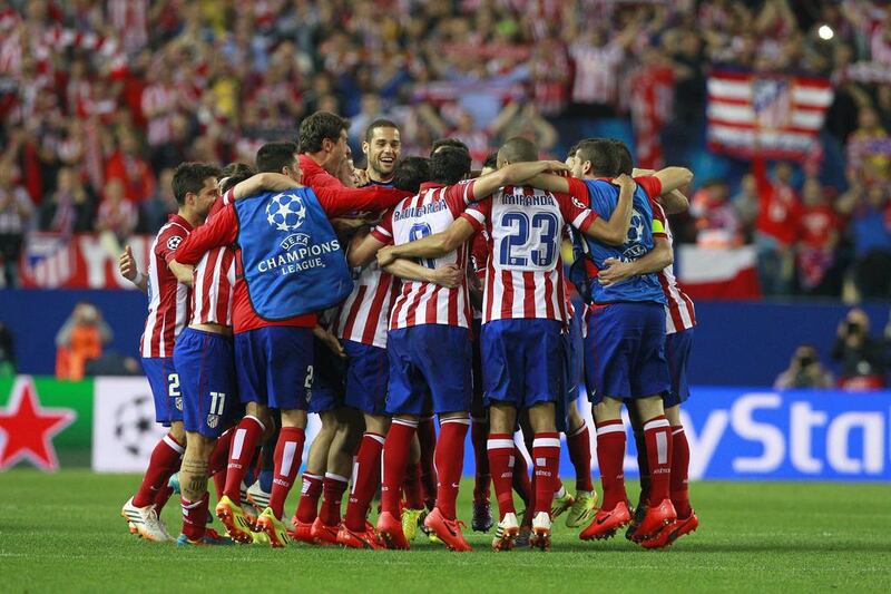 Atletico Madrid players celebrate after the Champions League quarter-final victory over FC Barcelona. Ballesteros / EPA / April 9, 2014
