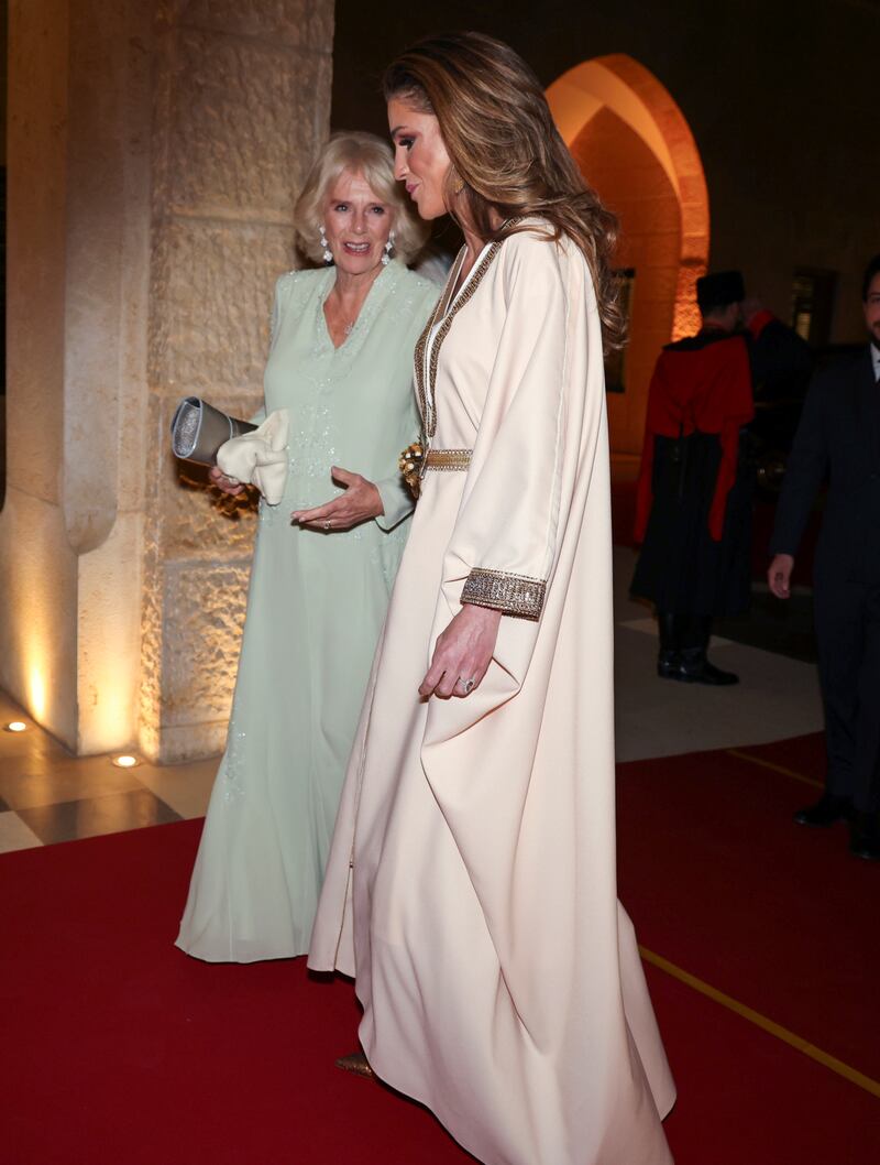 Camilla was seen dressed in a flowing patterned white kaftan and carrying a pastel pink scarf while Queen Rania looked regal in a pastel pink kaftan dress which she paired with Dior pumps. Reuters