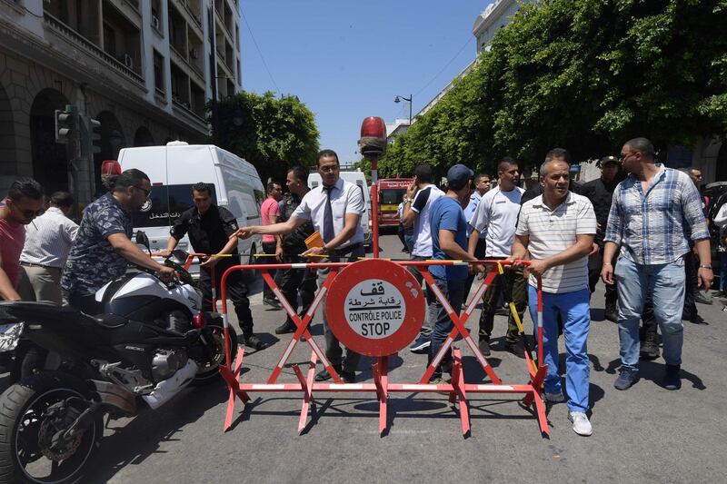 Tunisian security forces cordon off the site of an attack in the Tunisian capital's main avenue Habib Bourguiba.  AFP