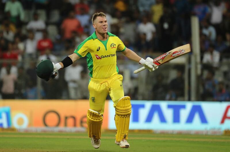 FILE - In this Tuesday, Jan. 14, 2020 file photo, Australia's David Warner celebrates after scoring a hundred during the first one-day international cricket match between India and Australia in Mumbai, India. David Warner, Steve Smith and Australia are back in South Africa for the first time since the ball-tampering drama of two years ago that led to 12-month bans for Warner and Smith, lost Smith the captaincy, and threw their team into turmoil. A three-match Twenty20 series gets underway on Friday, Feb. 20.  (AP Photo/Rafiq Maqbool, file)