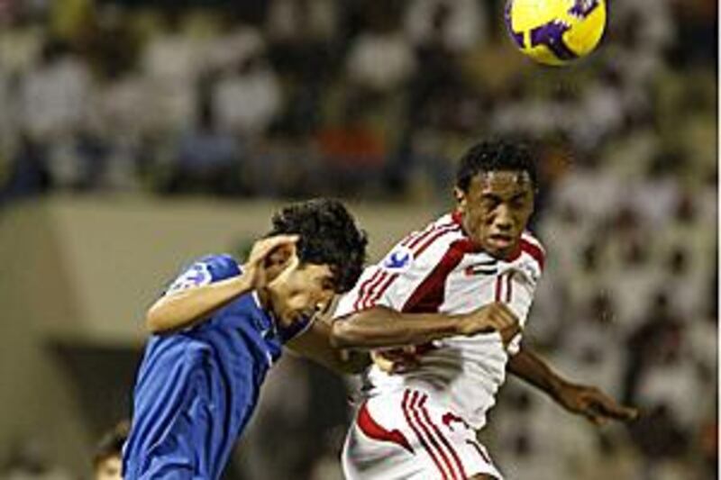 Al Ahli's Ahmed Khalil, right, is likely to train at Chelsea.