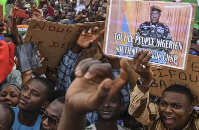 Supporters of coup leader Gen Abdourahmane Tchiani hold a rally at Place de la Concertation, in Niamey. AFP