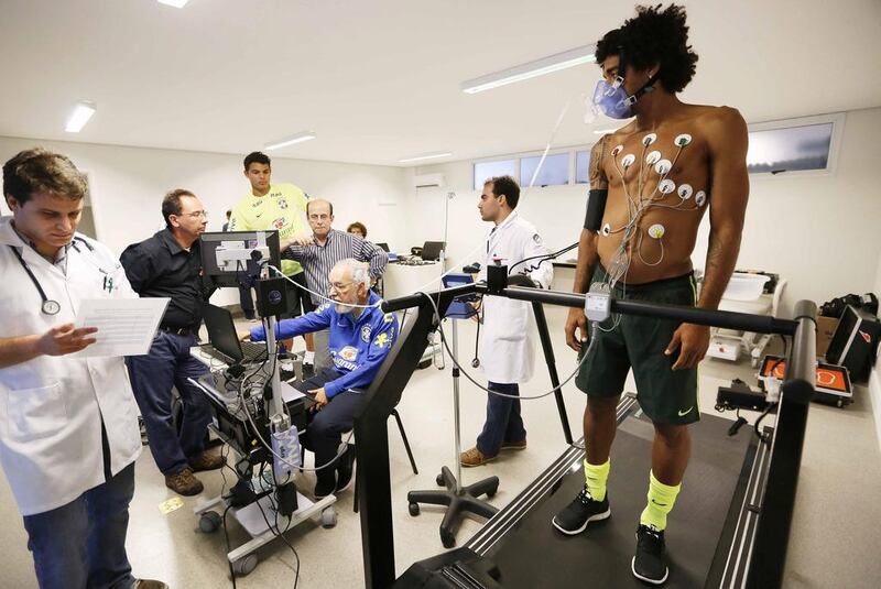 A handout photo released by the Brazilian Football Confederation (CBF) shows Brazil's national team players Thiago Silva, far, and Dante, near, during a medical test on Monday. Rafael Ribeiro / EPA / CBF / May 26, 2014