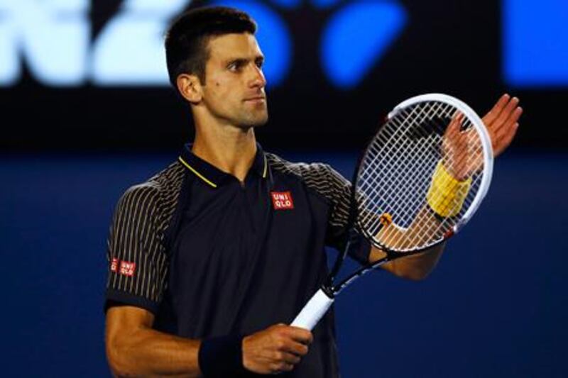 Novak Djokovic applauds Andy Murray during their Australian Open final match in Melbourne.