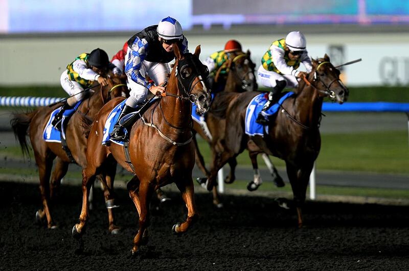Bigg N Rich and jockey Gerald Avranche, centre, pushing for home in the Mazrat Al Ruwayah Prep race at the Meydan Racecourse in Dubai on Thursday. Satish Kumar / The National