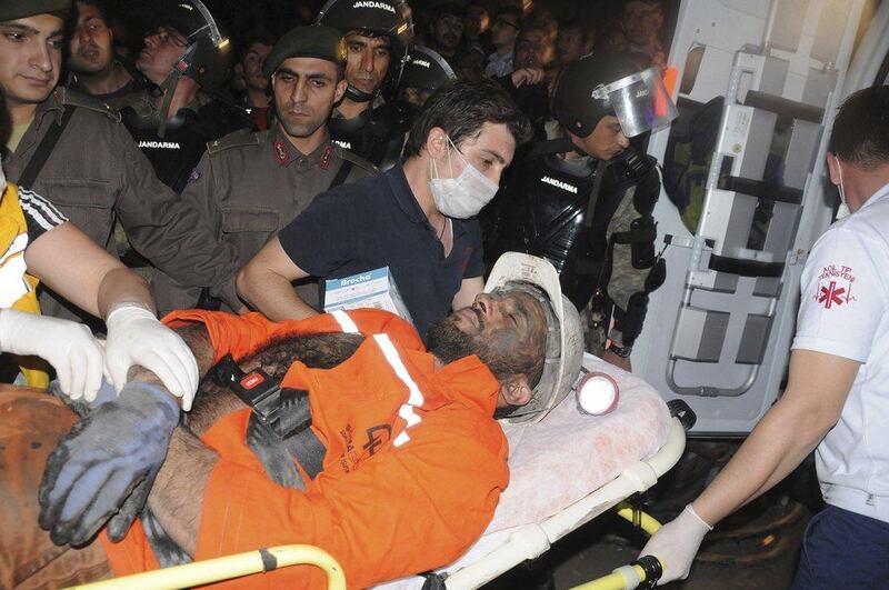 An injured miner is carried to an ambulance in Soma. An explosion and fire in the coal mine in western Turkey killed at least 200 mindes on Tuesday and many more have been trapped in the mine. Depo Photos / Reuters