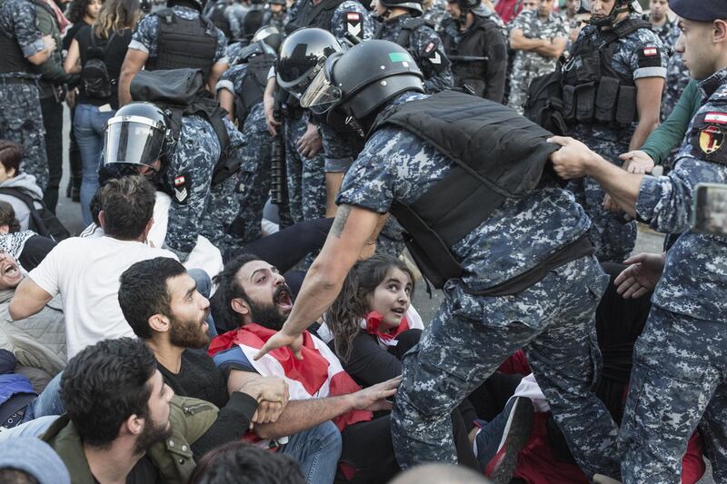Riot police remove anti-government protesters occupying the "Ring" intersection in Beirut. Getty Images