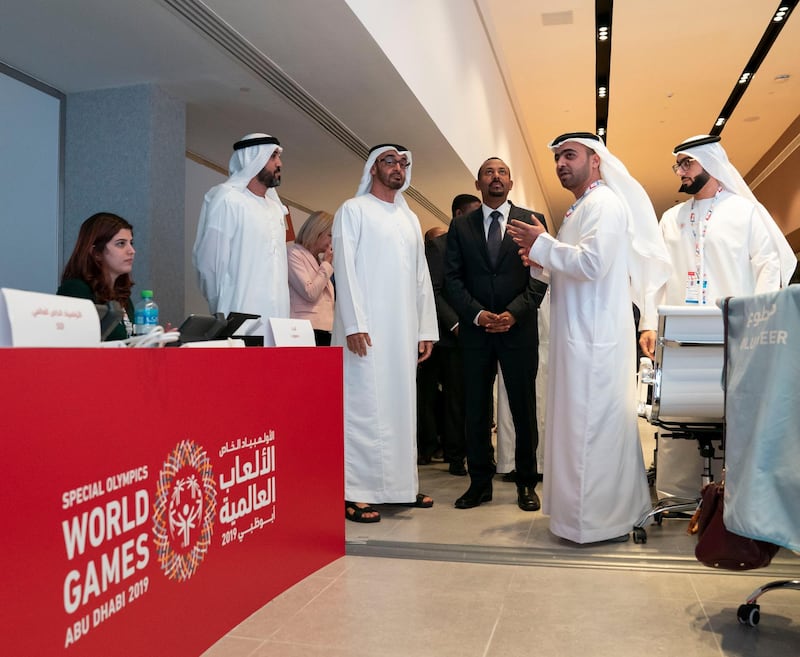 ABU DHABI, UNITED ARAB EMIRATES - March 20, 2019: HH Sheikh Mohamed bin Zayed Al Nahyan, Crown Prince of Abu Dhabi and Deputy Supreme Commander of the UAE Armed Forces (2nd L) and HE Abiy Ahmed, Prime Minister of Ethiopia (3rd L), tour the Special Olympics World Games Abu Dhabi 2019 at Abu Dhabi National Exhibition Centre. Seen with Khalfan Al Mazrouei, Managing Director at Special Olympics World Games Abu Dhabi 2019 (2nd R) and HE Mohamed Mubarak Al Mazrouei, Undersecretary of the Crown Prince Court of Abu Dhabi (L). 

( Mohamed Al Hammadi / Ministry of Presidential Affairs )
---