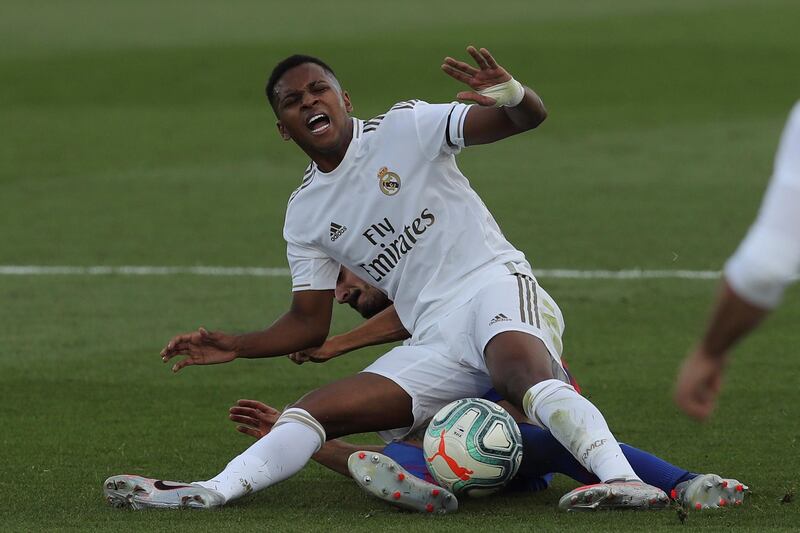 Real Madrid's Rodrygo is tackled from behind by Rafa Soares of Eibar. EPA