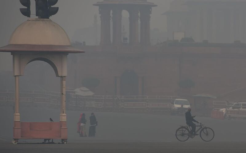 A government employee makes his way into work. AFP