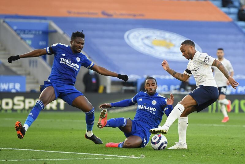 Manchester City's Raheem Sterling attempts to keep the ball as Leicester's Daniel Amartey (L) and Ricardo Pereira dive to block a shot. EPA