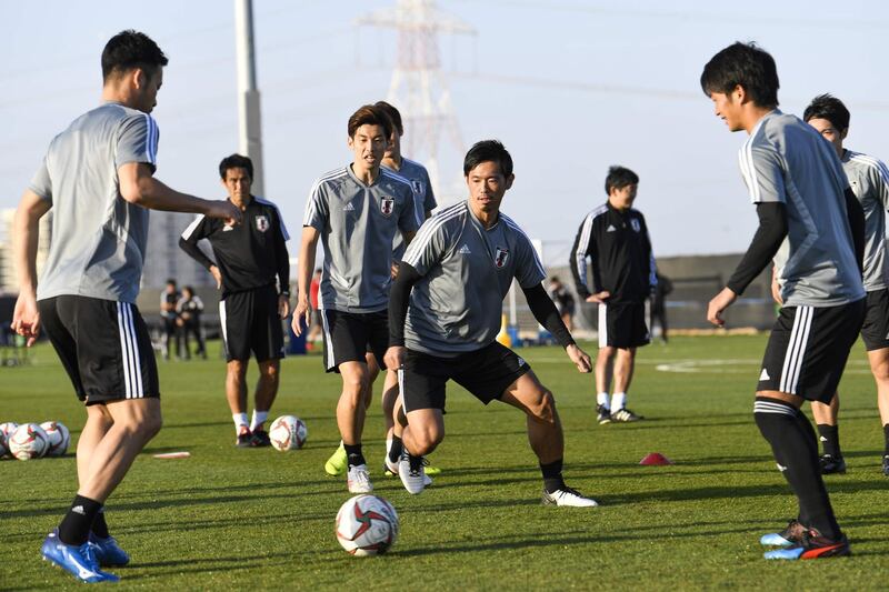 Players of Japan's national football team attend a training session ahead of the AFC Asian Cup final match against Qatar in Abu Dhabi on January 31, 2019.   / AFP / Khaled DESOUKI
