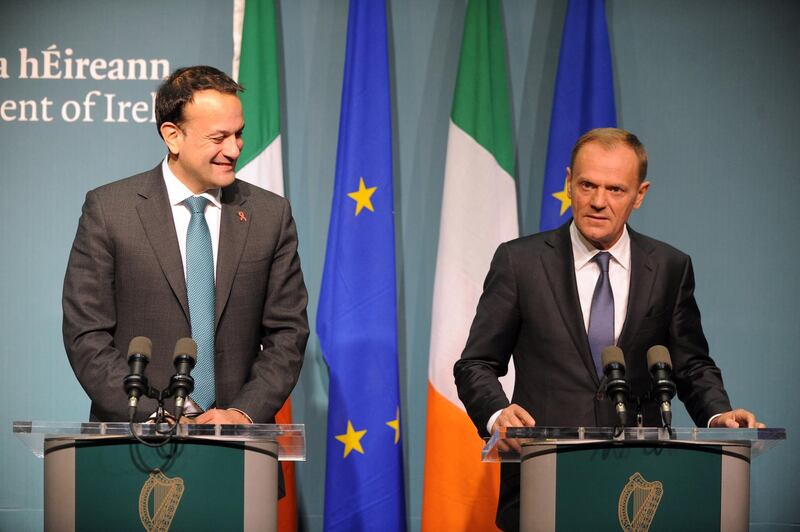 epa06362153 President of the European Council Donald Tusk (R) and Irish prime minister An Taoiseach Leo Varadkar (L), during a joint statement at the Government Buildings in Dublin City, Ireland, 01 December 2017. Tusk visits Ireland to discuss strategy ahead of the Brexit summit scheduled for 14 December.  EPA/AIDAN CRAWLEY