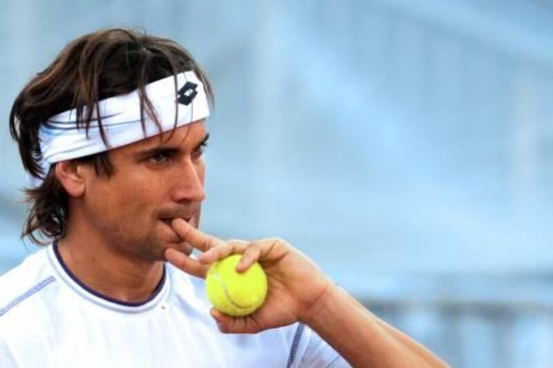 Spain's David Ferrer gestures during a training session at La Cartuja's Olympic Stadium, in Sevilla on November 29, 2011 ahead of the Davis Cup final matches against Argentina. AFP PHOTO / CRISTINA QUICLER