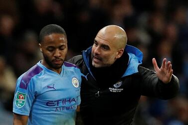 Manchester City manager Pep Guardiola with Raheem Sterling. Reuters
