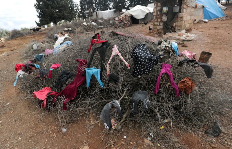 Clothes hang to dry on a cluster of branches in Azaz, Syria. REUTERS