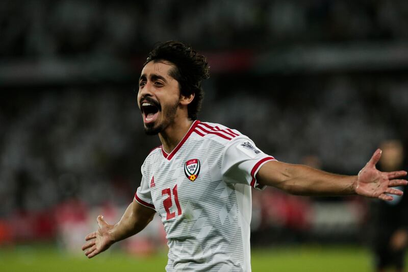 United Arab Emirates' midfielder Khalfan Mubarak scores first goal between India's Anirudh Thapa, left, and Anas Edathodika during the AFC Asian Cup group A soccer match between the United Arab Emirates and India at Zayed Sports City in Abu Dhabi, United Arab Emirates, Thursday, Jan. 10, 2019. (AP Photo/Nariman El-Mofty)