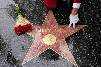 Flowers lie on the Hollywood Walk of Fame star of the late broadcasting giant Larry King, Saturday, Jan. 23, 2021, in Los Angeles. King, the host of "Larry King Live" on CNN for over 25 years, died Saturday at Cedars-Sinai Medical Center in Los Angeles. He was 87. (AP Photo/Chris Pizzello)