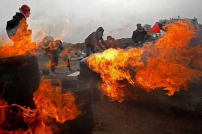 Palestinians take part in a protest against the U.S. President Donald Trump's Middle East peace plan, near the Jewish settlement of Beit El in the Israeli-occupied West Bank February 14, 2020. REUTERS/Mohamad Torokman