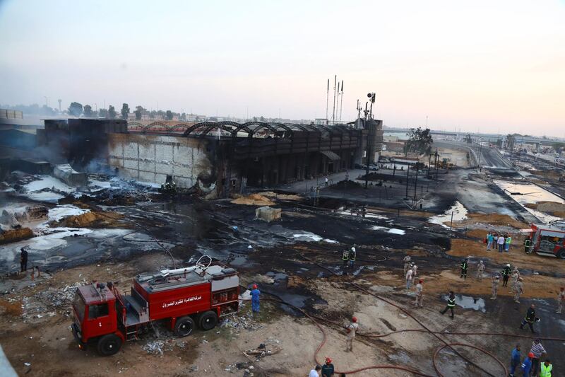 General view of burnt-out cars in Cairo, Egypt. According to reports, leakage of petroleum pipeline caused a fire on Ismailia Desert Road near Cairo, injuring at least 12 people. EPA