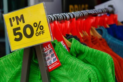 A rail of discount clothes hang in the doorway of Mountain Warehouse Group Ltd. in Canterbury, U.K., on Tuesday, Nov. 3, 2020. U.K. retailers face a Christmas disaster after the government ordered non-essential stores across England to shut for four weeks just as the busiest shopping season of the year was getting under way. Photographer: Luke MacGregor/Bloomberg