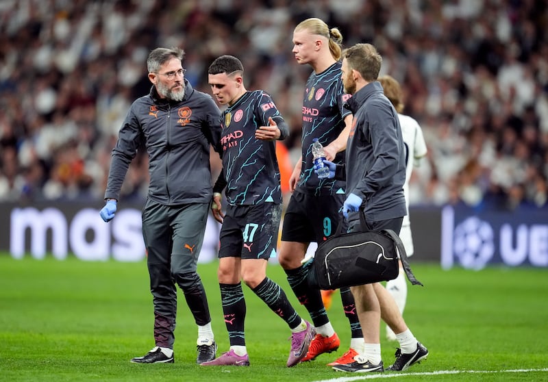 Phil Foden walks off injured but Pep Guardiola insisted the midfielder only suffered a knock. PA