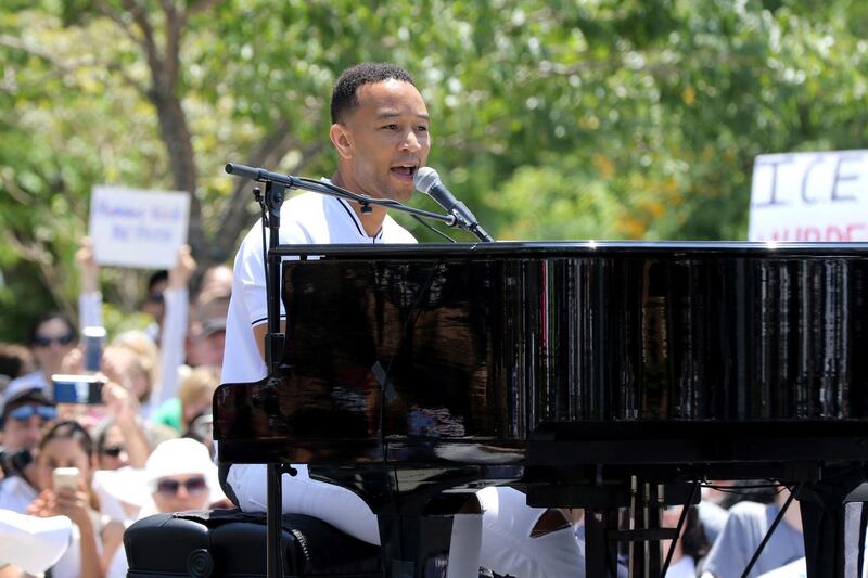 John Legend performs at the "Families Belong Together: Freedom for Immigrants" March in Los Angeles. Willy Sanjuan / Invision / AP